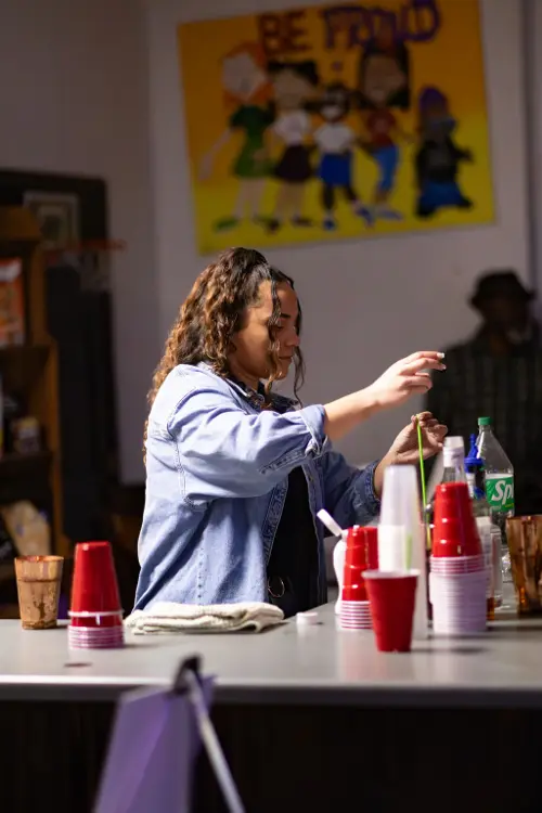 Guest mixing paint at the supply table